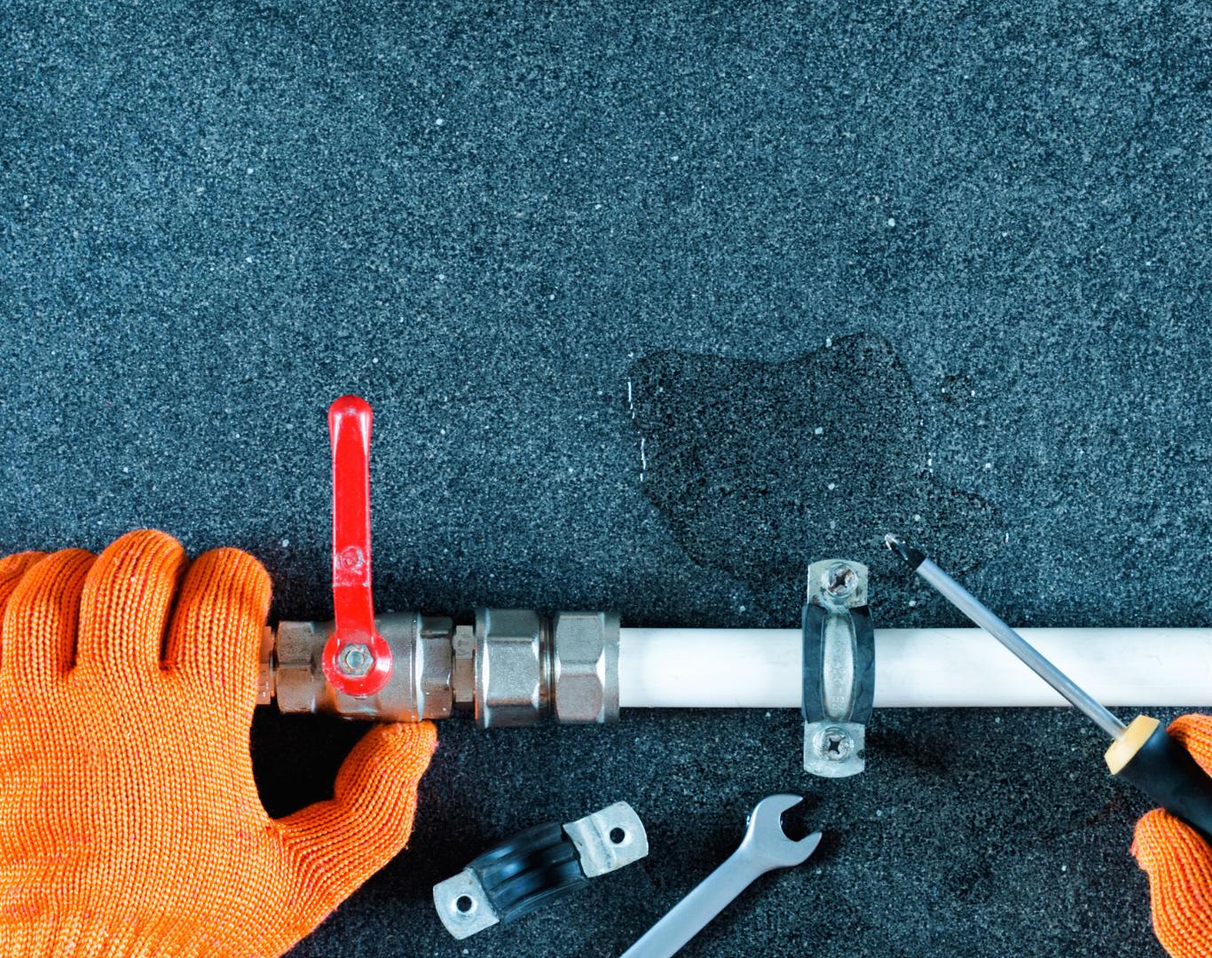 Certified plumber in Coppell, TX inspecting for underground leaks Certified plumber in Coppell, TX inspecting for underground leaks